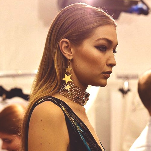 gigi-hadid-golden-long-star-earrings