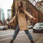 how-to-wear-boyfriend-jeans-nude-coat-black-boots-outfit
