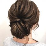 messy-brunette-low-updo-wedding-hairstyle-min