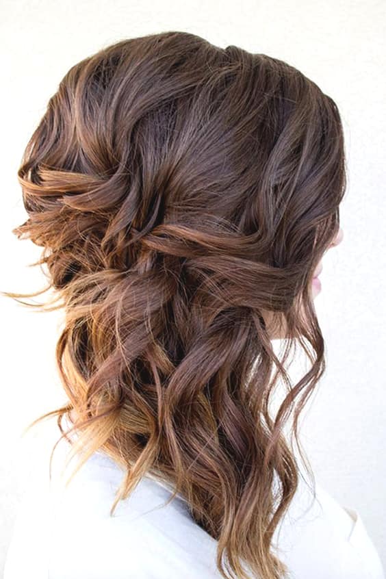 side-swept-curls-wedding-hairstyles-min