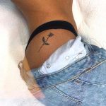 side-hip-minimal-rose-tattoo-min